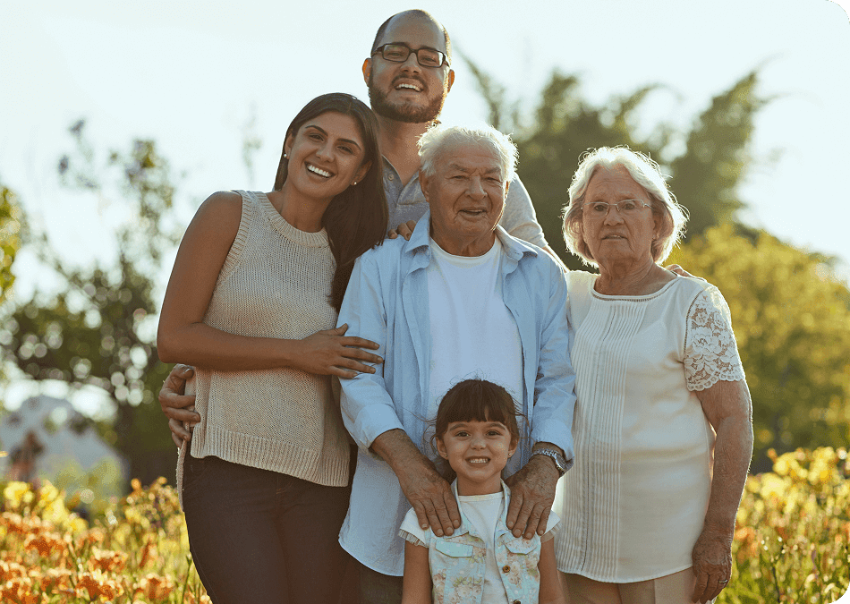 Multi-generational family portrait in outdoor natural setting