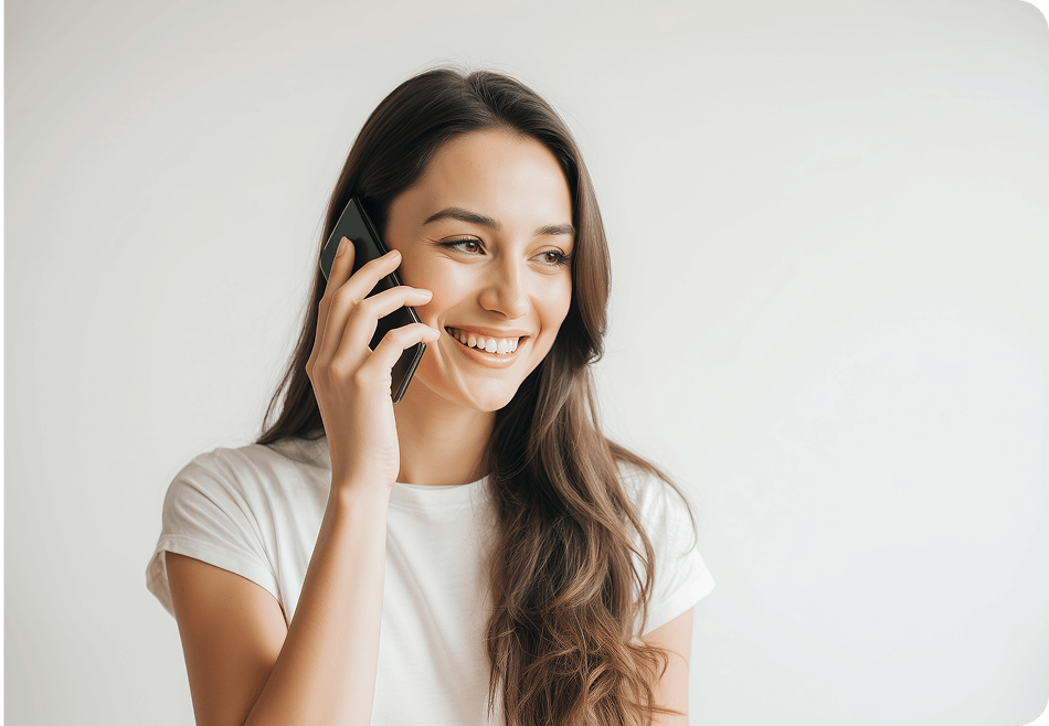 A young woman is talking on the phone.