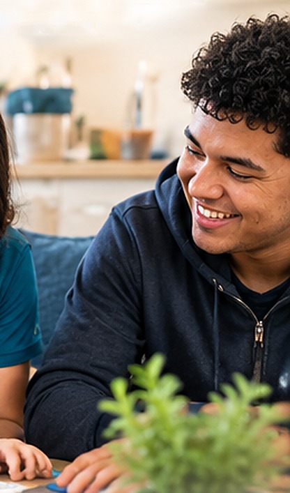 Smiling teen with his family during ODP waiver services